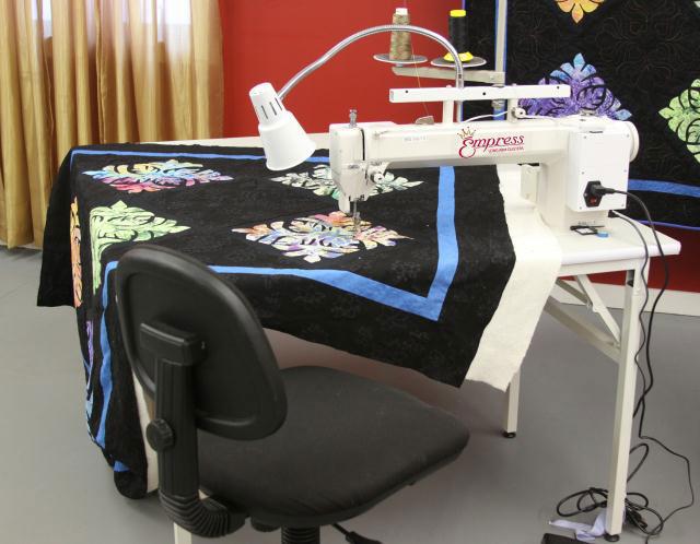 Tin Lizzie Empress Sit Down with Table. Check Out Handi Quilter Sweet Sixtween Long Arm Below!
